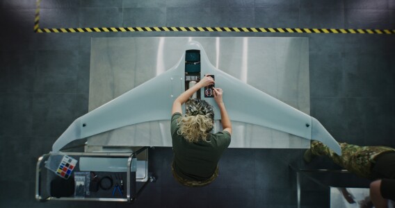 Woman working on drone aerial view