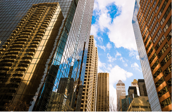 Urban skyline showing architectural diversity, with modern reflective towers alongside traditional high-rises.