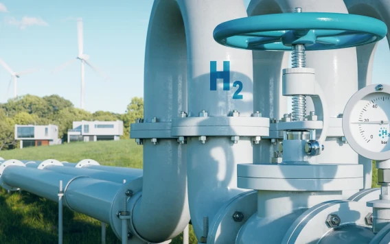 Hydrogen pipeline infrastructure with pressure gauge, wind turbines, and homes in a green landscape.